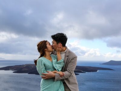 Chinese man and woman portraiture in winter Santorini